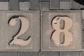 Parking place with 28 number. Close-up of a number marking in a parking lot.