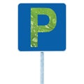 Parking place road sign pole post, traffic roadside signage, blue, green leaf P closeup, raindrops, isolated environment friendly Royalty Free Stock Photo