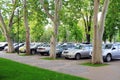 Parking place under plane trees.