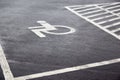 Parking spaces with lines of signs for disabled people on asphalt Royalty Free Stock Photo