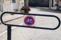 Parking prohibited for bicycles fence with sign text french means stationnement interdit Royalty Free Stock Photo