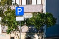 Parking road sign with a blank information plate on the background of a residential house, mock-up Royalty Free Stock Photo