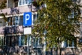 Parking road sign with a blank information plate on the background of a residential house, mock-up Royalty Free Stock Photo