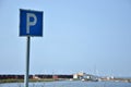 Parking sign on a background inoperative at this time of year, a small port