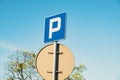 Parking sign showing free places. Traffic parking sign with clean sky and light ray. Cars became biggest problem for Royalty Free Stock Photo