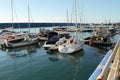 Parking small boats are in the berth of the seaport of Adler