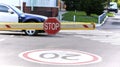 Parking space in the building with automatic barrier and stop sign