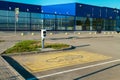 Parking space for an electric car with charger station outdoor.