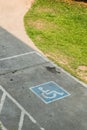 Parking space reserved handicapped on road Royalty Free Stock Photo