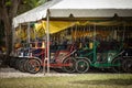 Parking for surrey bicycles in oldest the zoo Miami. Family bicycles for four people are waiting for a trip Royalty Free Stock Photo