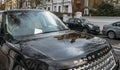 Parking ticket for a penalty or fine stuck on Range Rover car`s windscreen, captured in the Royal Borough of Kensington Royalty Free Stock Photo