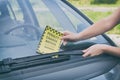 Parking ticket under windshield wiper Royalty Free Stock Photo