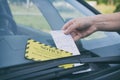 Parking ticket under windshield wiper Royalty Free Stock Photo