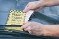 Parking ticket under windshield wiper Royalty Free Stock Photo