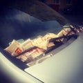 Parking tickets by a windscreen wiper