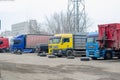 Parking of truck tractors and trucks. Group of trucks outdoors. Royalty Free Stock Photo