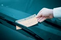 Parking violation ticket fine on windshield Royalty Free Stock Photo