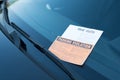 Parking violation ticket fine on windshield Royalty Free Stock Photo