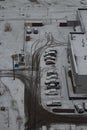 Parking in the winter season, traces in the snow. View from above.selective focus