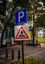 parking and zebra crossing sign board on the roadside Royalty Free Stock Photo