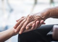 Parkinson disease patient, elderly senior person in support of nursing family caregiver for disability awareness day concept Royalty Free Stock Photo