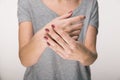 Parkinson`s disease symptoms. Close up of tremor shaking hands of Middle-aged women patient with Parkinson`s disease