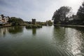 A parkland lake with a special bird reserve tower in springtime Royalty Free Stock Photo