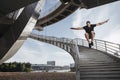 Parkour athlete doing a beautiful high jump from the stairs Royalty Free Stock Photo