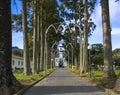 Parkway with small white and gray church of Sao Nicolau at the village of Sete Cidades on the island of Sao Miguel Royalty Free Stock Photo