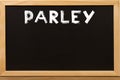 Parley word write by white chalk on a blackboard Royalty Free Stock Photo