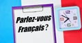 Parlez - vous franÃÂ§ais ? The inscription on the notebook is in French. Royalty Free Stock Photo