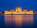 Parliament building in Budapest, Hungary. Parliament and reflections in the Danube River. Blue hour and evening illumination of th Royalty Free Stock Photo