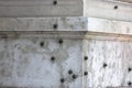 Traces of bullets on the wall of a historic building