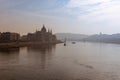 Parliament building and Danube river in the foggy morning, Budapest, Hungary