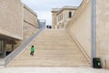 Parliament building, huge stairs and historic fortification walls in Malta`s capital city gate, made of stone