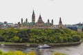 Parliament Hill, Ottawa, Rideau canal. Cruise ship. Cloudy sky in Autumn city Royalty Free Stock Photo