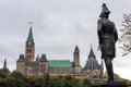 Parliament Hill, Ottawa, Rideau canal. Cruise ship. Cloudy sky in Autumn city Royalty Free Stock Photo