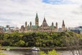 Parliament Hill, Ottawa, Rideau canal. Old bridge. Cloudy sky in Autumn city Royalty Free Stock Photo