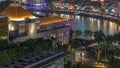 Parliament House in downtown Singapore aerial night timelapse and boat quay in the background. Royalty Free Stock Photo