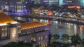 Parliament House in downtown Singapore aerial night timelapse and boat quay in the background. Royalty Free Stock Photo