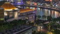 Parliament House in downtown Singapore aerial night timelapse and boat quay in the background. Royalty Free Stock Photo