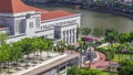 Parliament House in downtown Singapore aerial timelapse and boat quay in the background. Royalty Free Stock Photo