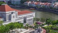 Parliament House in downtown Singapore aerial timelapse and boat quay in the background. Royalty Free Stock Photo