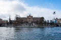 The Parliament House of Sweden in front view with sea gulls flying over the river