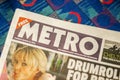 LONDON, ENGLAND- 16 March 2021: METRO newspaper on a tube train seat