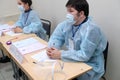 Almaty, Kazakhstan - 01.10.2020 : Members of the Central election Commission in protective suits. Parliamentary elections in