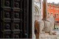 Parma, detail of the entrance with ancien lion sculpture, romanic cathedral in the duomo square