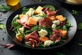Parma ham and melon salad with mozzarella, green leaves mix Royalty Free Stock Photo