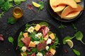 Parma ham and melon salad with mozzarella, green leaves mix Royalty Free Stock Photo