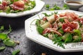 Parma ham and melon salad with mozzarella, rocket and pine nuts Royalty Free Stock Photo